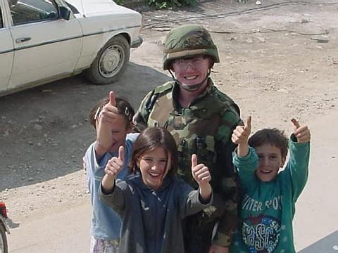 Staff Sergeant Butler and kids